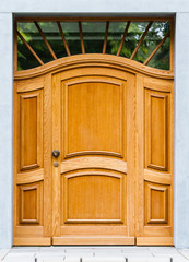 Wooden front door of a home. Old Wooden Door.