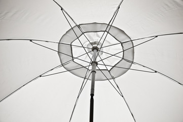 white umbrella in a beach