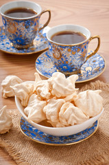 White-cream meringue on plate and coffee