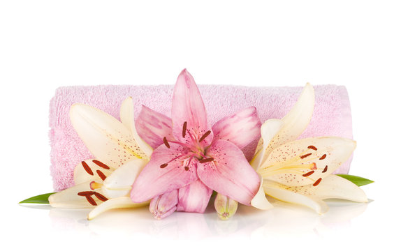 Spa setting with colorful lily flowers
