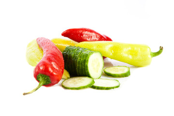chilli and cucumber isolated on white background