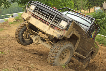 Off-road vehicle on top of a steep hill