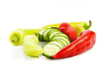 chilli and cucumber isolated on white background