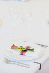 Exotic theme table setting. Decor with fresh calla