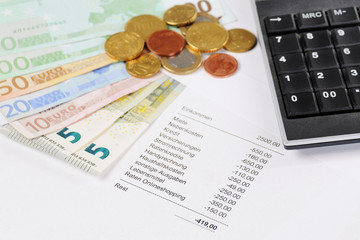 Fototapeta premium Euro bill and Coins with chart and calculator