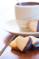 Heart shaped cookies and a fresh cappuccino