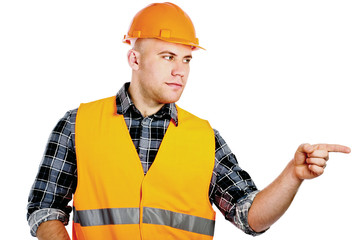 A young construction worker pointing something