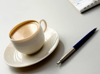 Cup of coffee near press