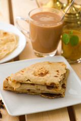 chapathi traditional indian food with settings on background