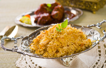 Briyani mutton rice papadam with traditional background