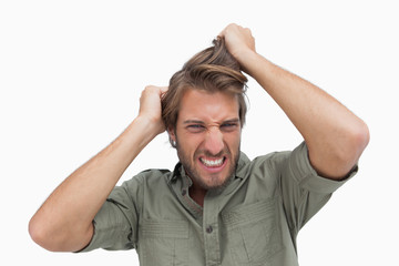 Frustrated man pulling his hair