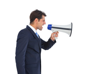 Fototapeta premium Side view of a businessman shouting on his megaphone
