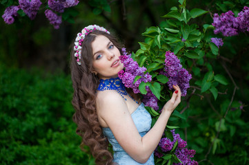 beautiful girl with a flower lilac