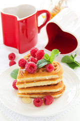Waffles with raspberry, honey and chocolate.