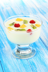 Delicious yogurt with fruit on table close-up