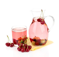 Pitcher of compote with summer berries isolated on white