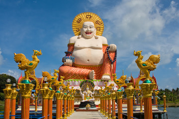 Smiling Buddha of wealth statue on Koh Samui, Thailand