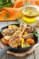 Fried chicken legs with vegetables.