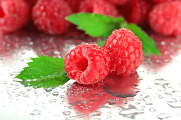 Ripe sweet raspberries with drops, close up