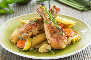 Fried chicken legs with vegetables.
