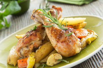 Fried chicken legs with vegetables.