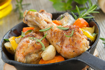 Fried chicken legs with vegetables.