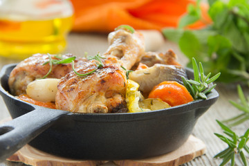 Fried chicken legs with vegetables.
