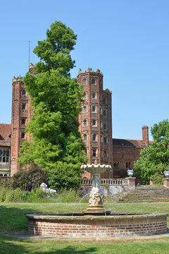 elizabethan tower with fountain in foreground