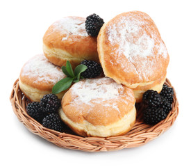 Tasty donuts with berries, isolated on white