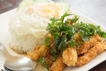 Fried chicken stir crispy basil with fried egg