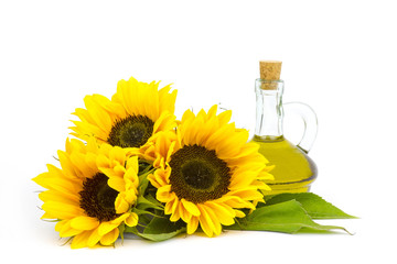 Glass bottle with sunflower oil and sunflowers