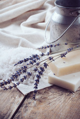 soap, lavender, salt and old can on wooden board