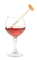 Glass of wine with thermometer, isolated on white