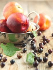 Nectarines and black currant. Selective focus