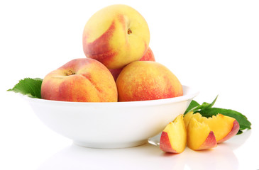 Fototapeta na wymiar Ripe sweet peaches in bowl, isolated on white