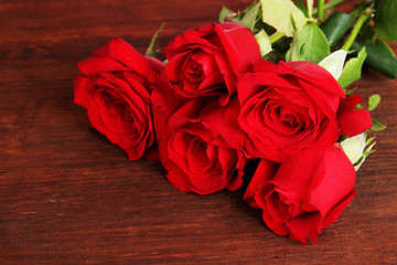 Beautiful bouquet of roses on table close-up