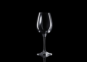 Empty glass of wine on black background