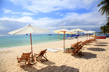 Chairs and umbrellas on a White beach, Boracay, Philippines