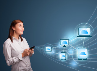 Pretty lady typing on smartphone with cloud computing
