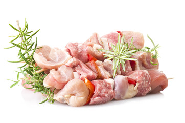 chicken skewers and rosemary close up on white