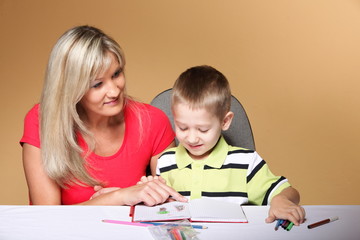 mother and son drawing together