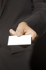 Business Man holding a business card