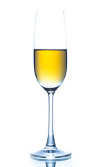 Elegant wine glass full of amber coloured wine on a white backgr