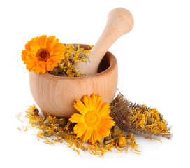 Fresh and dried calendula flowers in wooden mortar  isolated