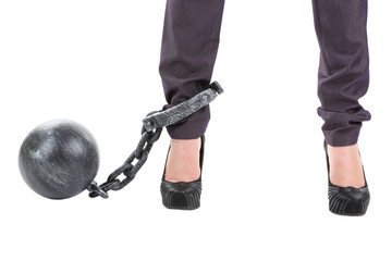 Business worker with ball and chain attached to foot isolated