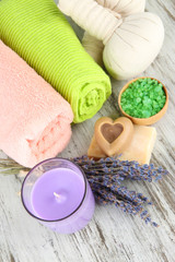 Fototapeta na wymiar Still life with lavender candle, soap, massage balls, soap and