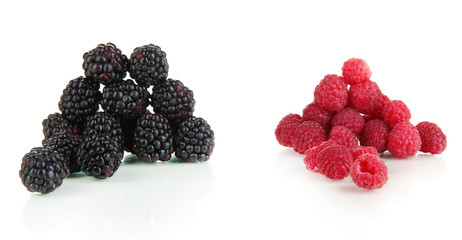 Ripe raspberries and blackberries isolated on white