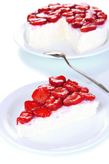 Cheesecake with fresh steawberry on white plate closeup