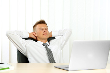 Fototapeta premium Portrait of young businessman in office