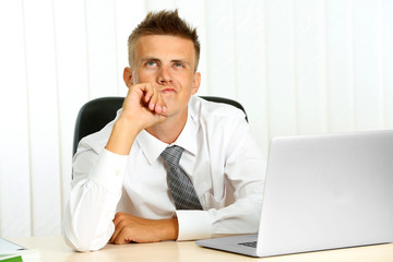 Portrait of young businessman in office